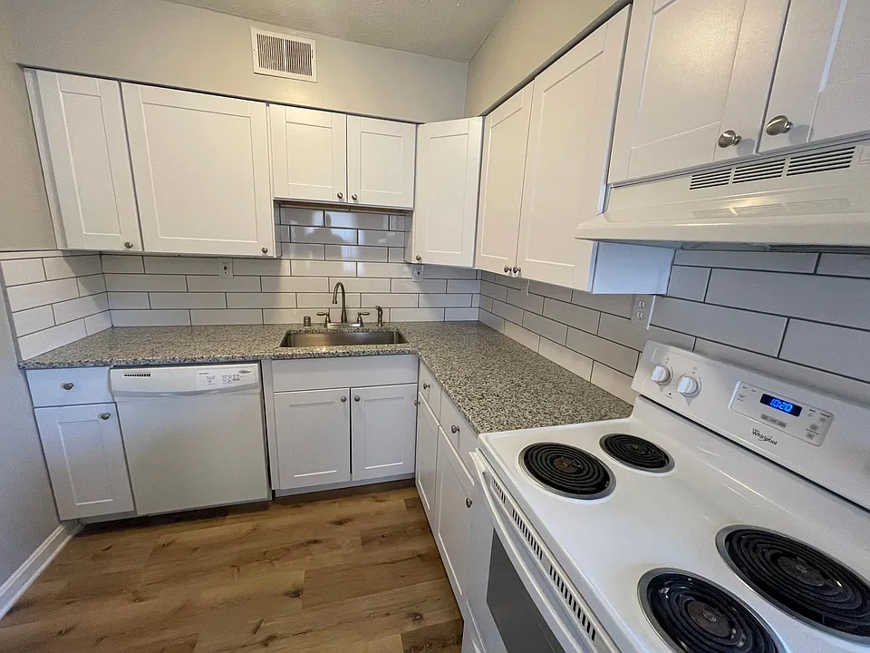 Kitchen featuring beautiful granite countertops and tiled backsplash