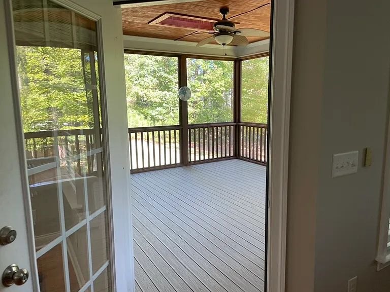 Exit Family Room to screened porch. Has ceiling and skylight