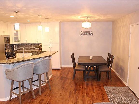 Open Spacious Dining Room & View of Kitchen