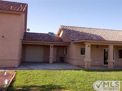 Recessed patio and tandem door for garage