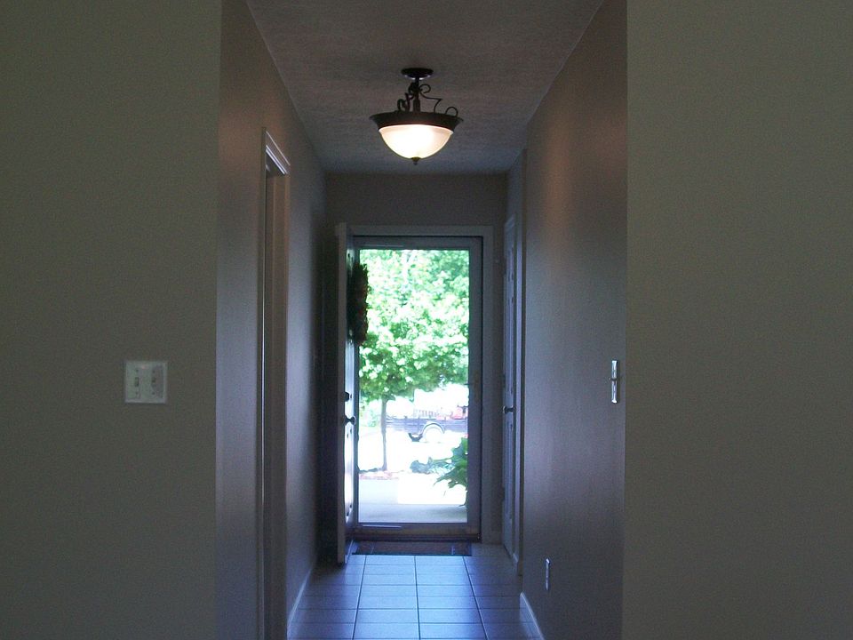 nice tiled entry & hallway, with a separate laundry room & garage access