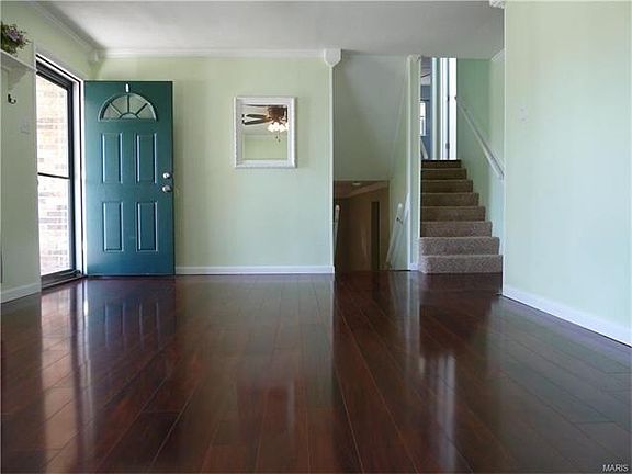 The stair way to the left takes you into the finished lower level family room and the stair way to the right will take you to the 3 bedrooms. You will find lots of crown molding in this house.