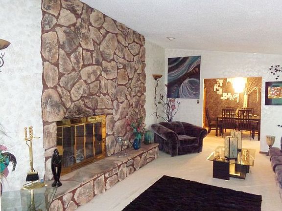 Two way stone fireplace in the living room.