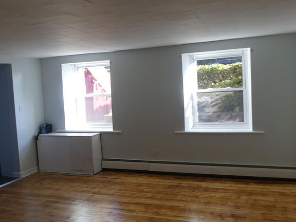 Living room with windows starting at ground level