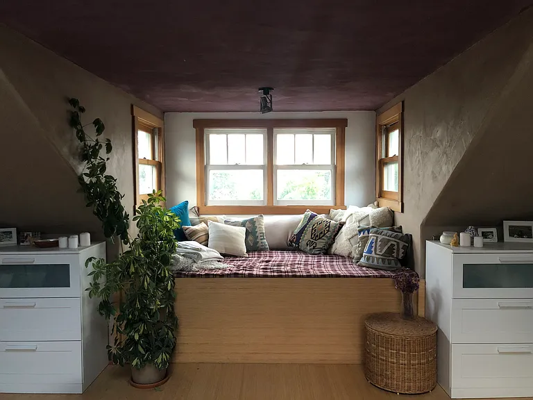 At the top of the stairs to your right is this hangout space. The white cabinets will move out with the current tenants. There is ample space for hanging clothes and shelves for storing clothes/ books / etc.