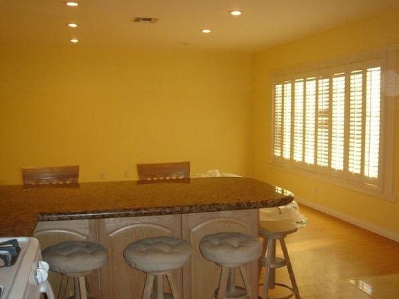 Large Living room Brand new paint & flooring 
Central Heat & A/C
Window shutters. Recessed lighting __