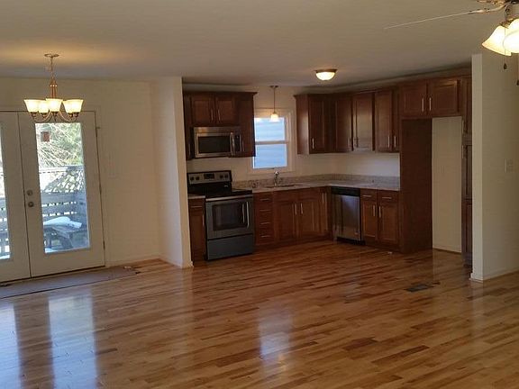 Refrigerator included just was not installed at the time of photos. Real Maple hardwood floors