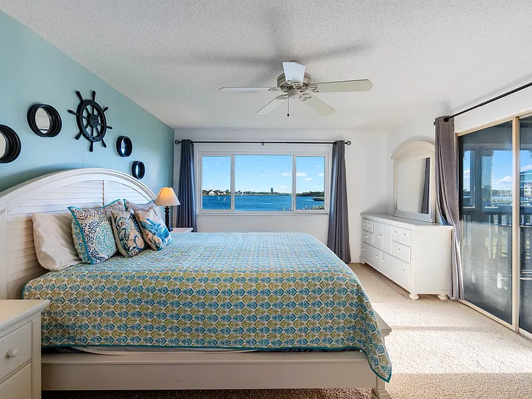 Wake up to spectacular views of the Intracoastal Waterway from the master bedroom. Featuring a California-King-size bed, a walk-in closet, a walk-in shower, and a separate sink and vanity.