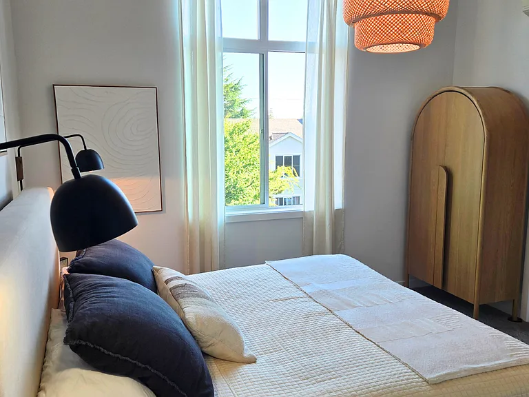 Your huge, walk-in closet has a window and built-in racks