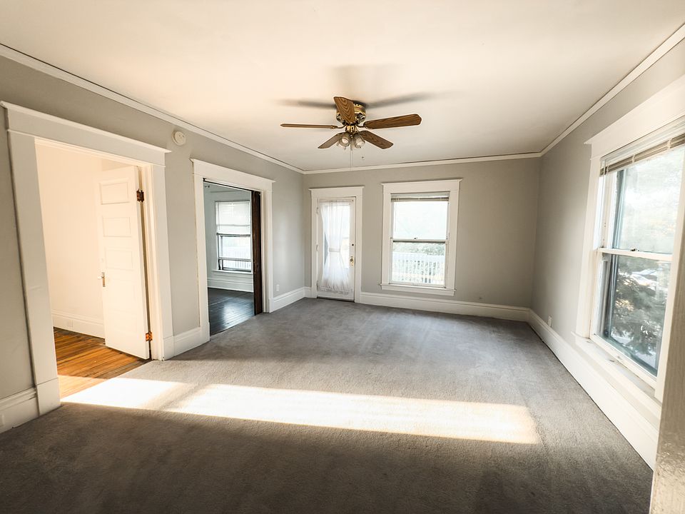 The door next to the window leads to a balcony in the front of the house pictured next.