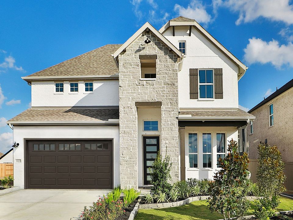 Stunning Creekhaven home with elegant brickwork, pristine stone features, and expansive windows.