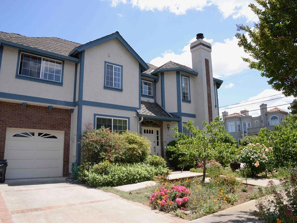 Welcome to 591 Lassen. That's your garage ... above it is the main bedroom, and to the far right on the upper floor is the second bedroom. The lower level includes kitchen, dining, and living room with fireplace.