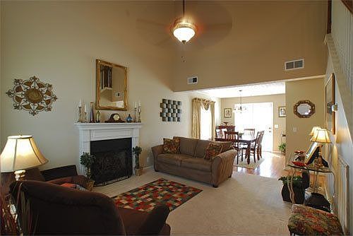 Great Room with Fireplace looking into Dining Room 