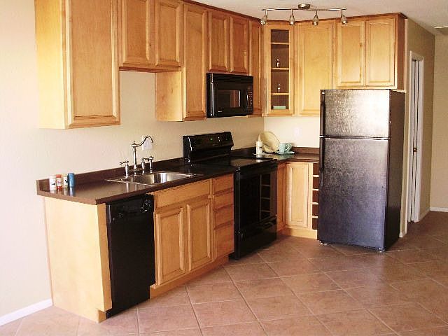 Newer Cabinets. Frig stays!