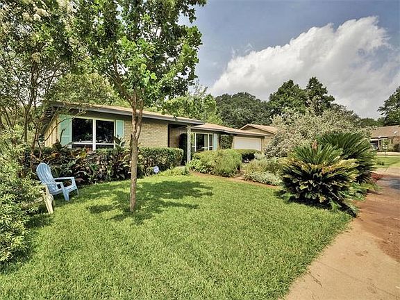 Lovely curb appeal and lush mature landscaping make for a beautiful entry.