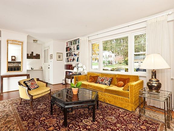 Another view of the living room and foyer