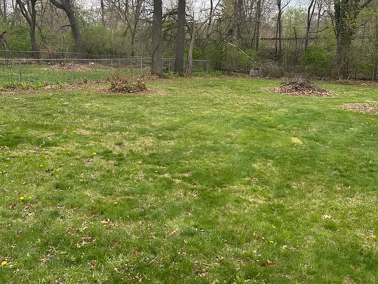 LARGE FENCED BACK YARD, WITH FIRE PIT FOR AND BACK PATIO WITH PICNIC TABLE.