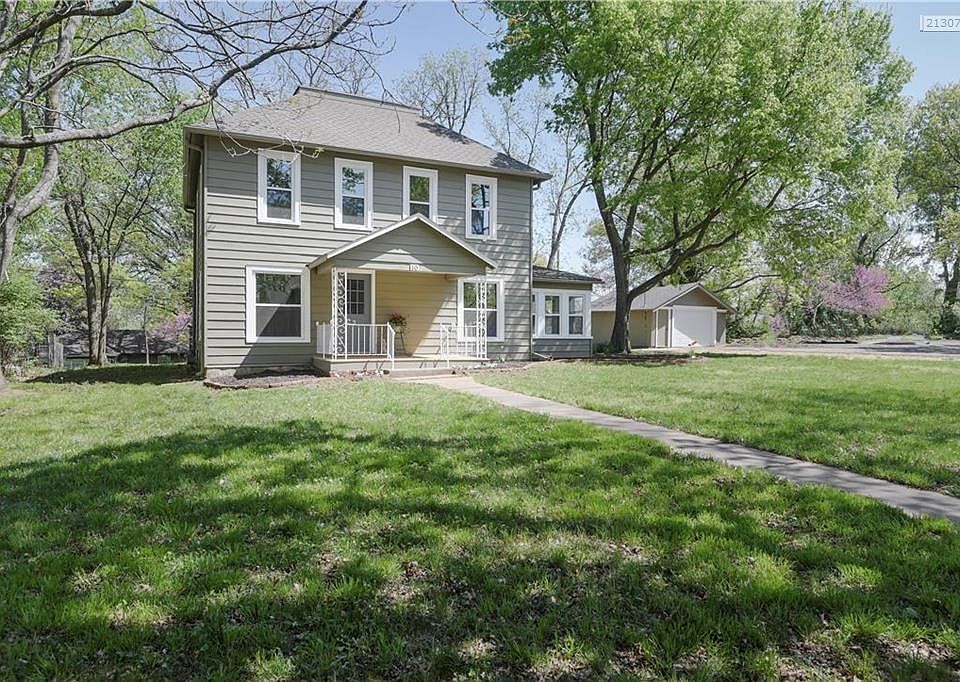 Front of home with new decking and windows.  Very large front yard!