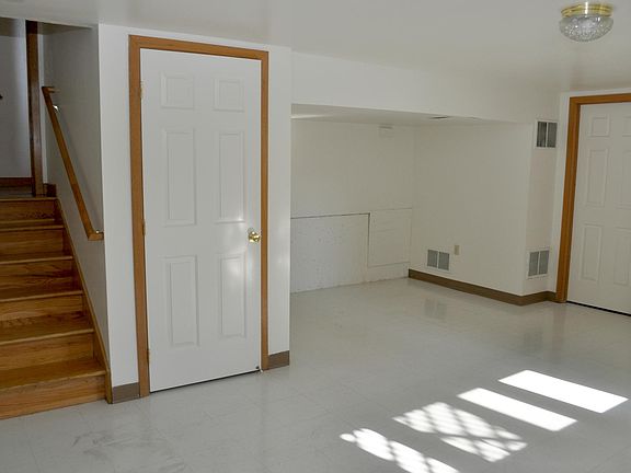 Arctic basement leading into spacious laundry and utility ro