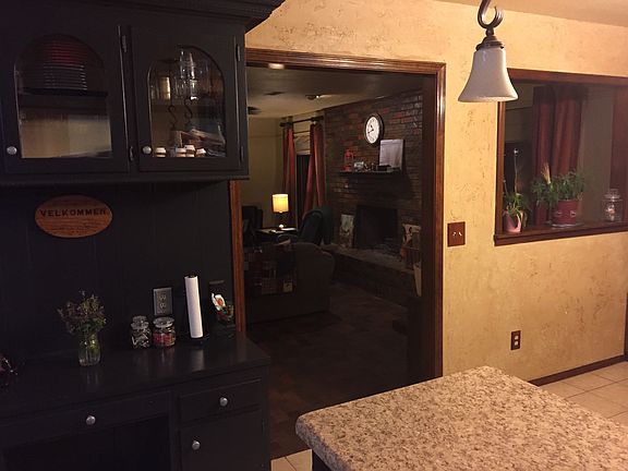 View from kitchen into living room past built-in