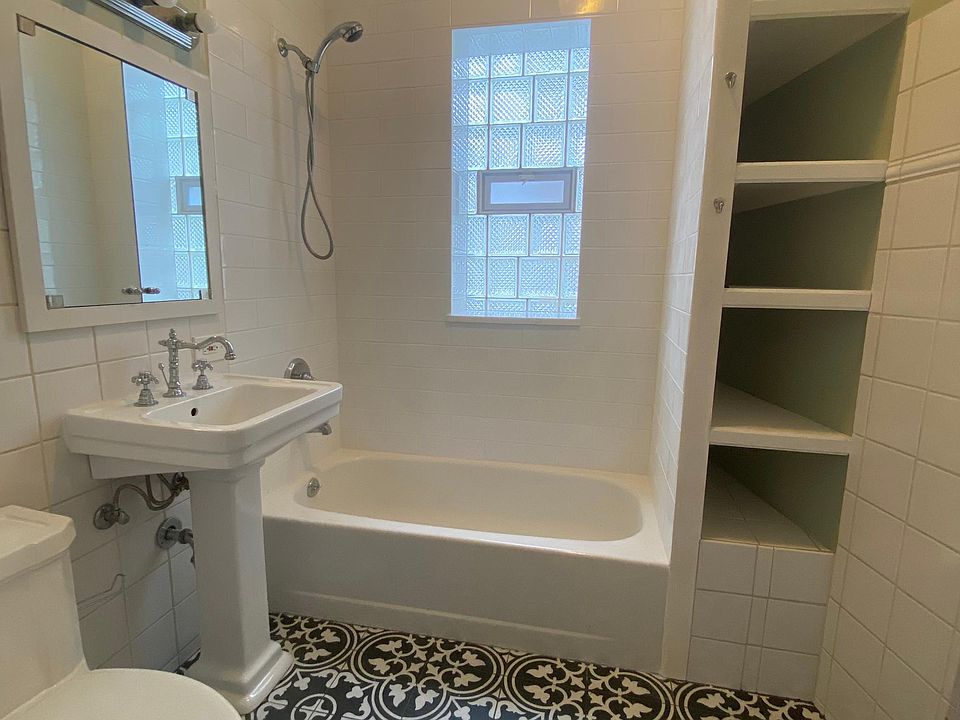 NEWLY TILED BATHROOM