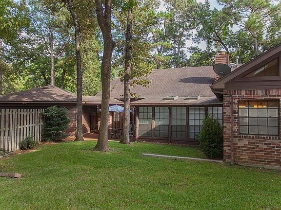 The one story floor plan has an enclosed sunroom off the bac
