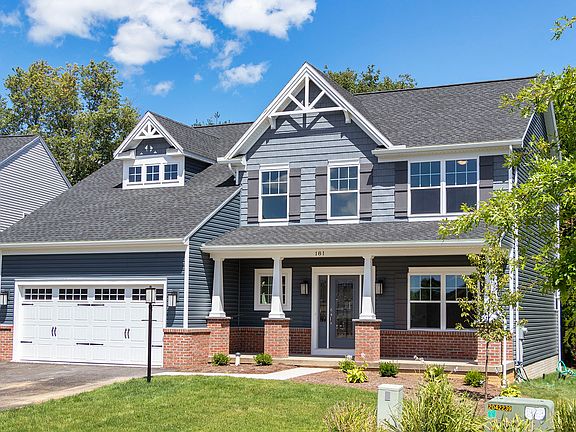 The Newport C - S A Home - exterior view - 2 story home with full front porch, partial brick front a