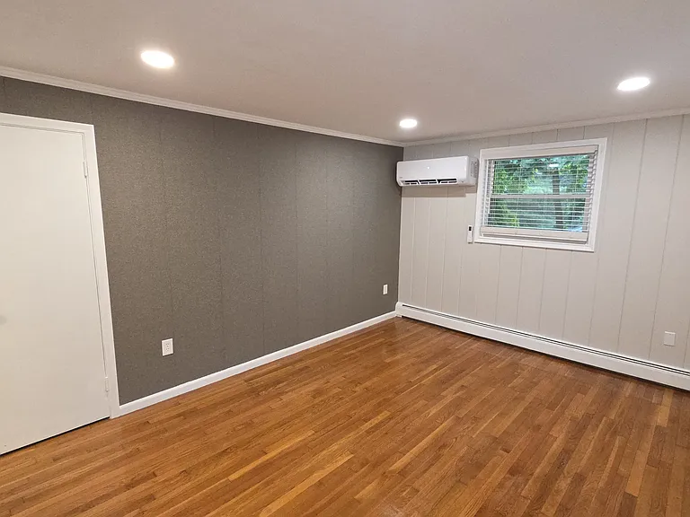 a living room; a mini split for heating and cooling