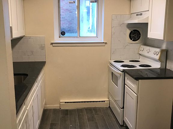 Kitchen, featuring solid granite countertops and new cabinet