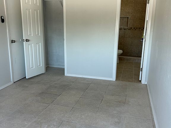 Master bedroom with his closet and entrance to master bathroom