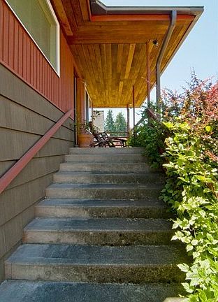 Enjoy a glass of wine on your covered  front porch and gaze out