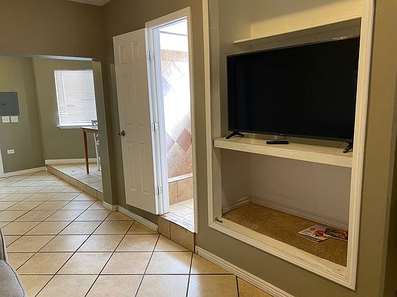 B Unit Living room looking at TV and downstairs 3/4 BATH.