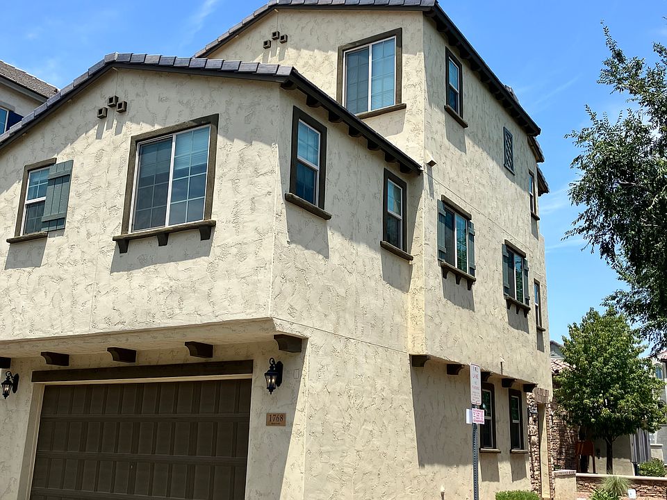 Two car garage with quiet opener and epoxy floors. Ceiling storage shelves included!