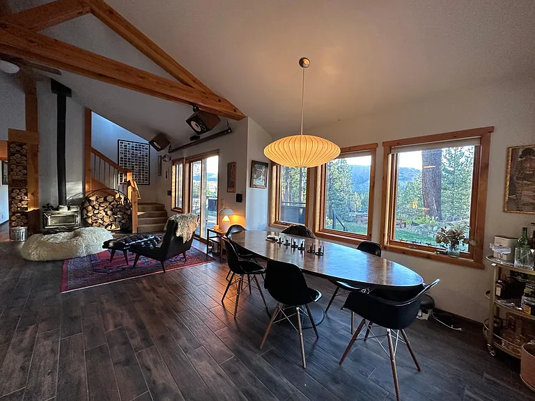Dining area and stairs to upstairs primary bedroom