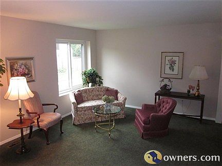 View of Living Room from bottom of upstairs staircase