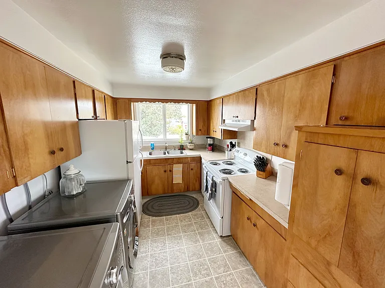 Kitchen comes stocked with dishwasher, microwave, refrigerator, washer/dryer, dishes, silverware, etc.