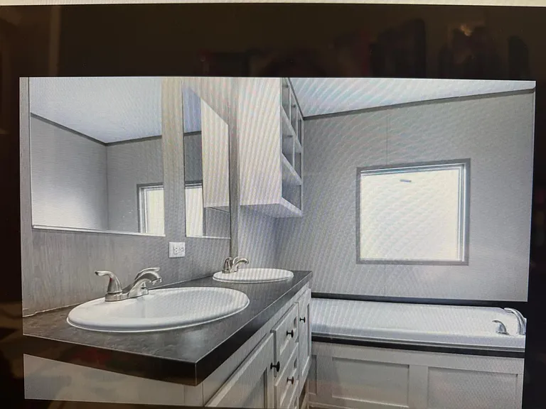 Master, deep tub, his and her sinks and a stand-a-lone shower