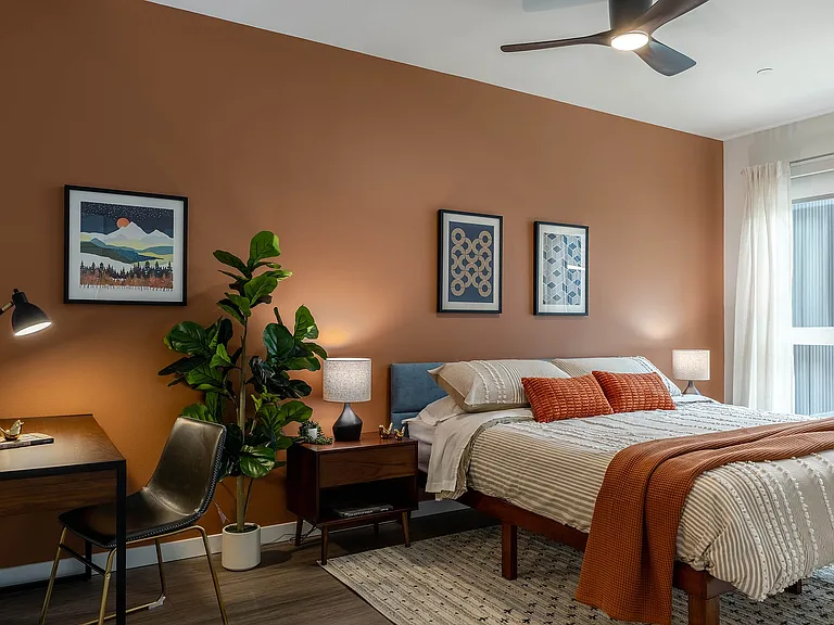 Bedroom with a sliding glass door and private balcony access