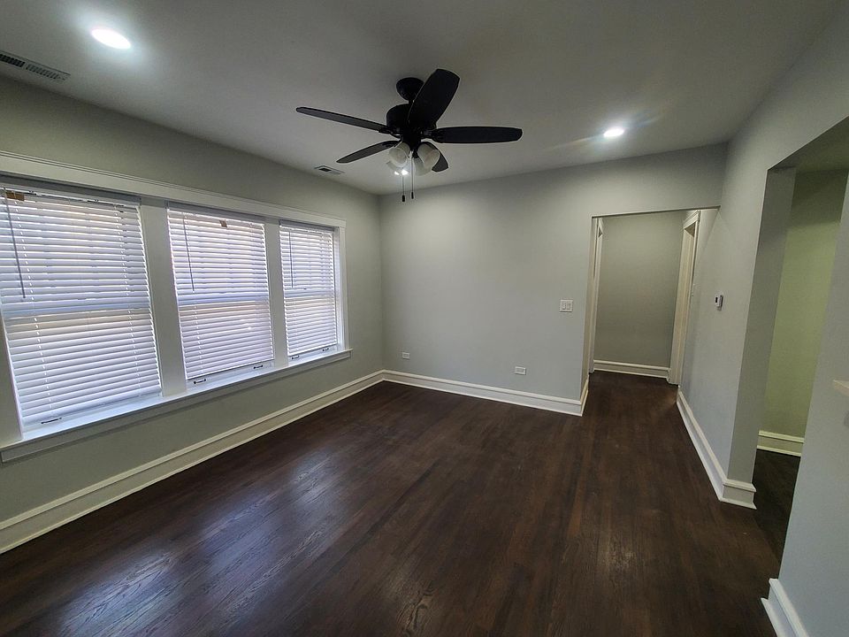 Living Room. New floors throughout, New Ceiling fans and blinds