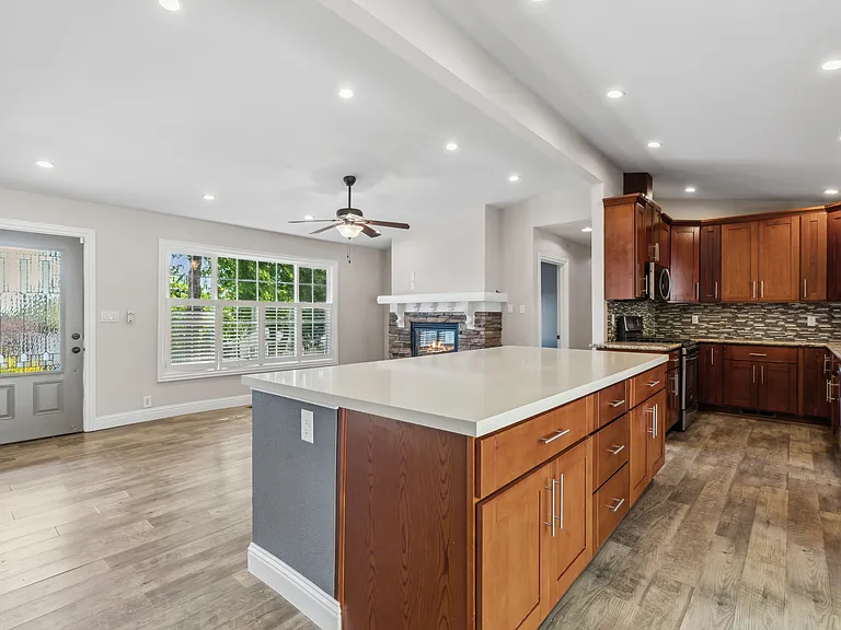 Open concept kitchen, counter, and dining area