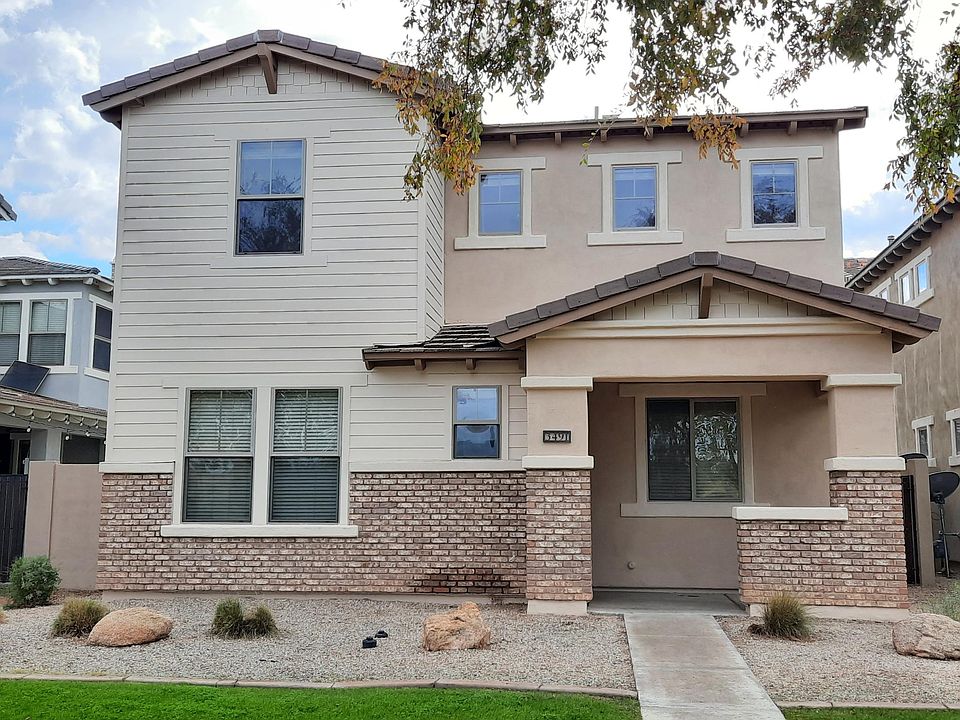 Newly painted exterior. House faces large open green space with walking path connecting to Agritopia.