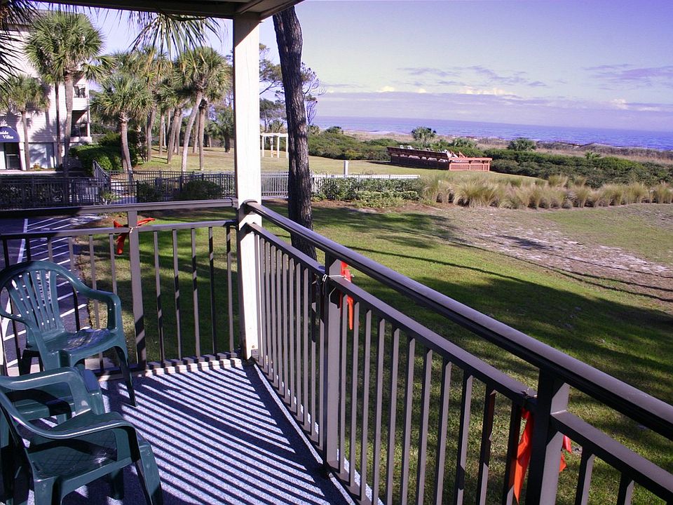 Panoramic views from this oceanfront end unit villa