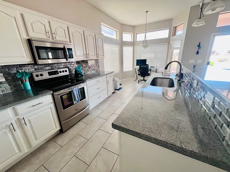 Open concept kitchen. Lots of natural light.