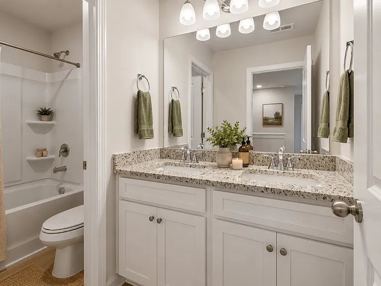 Secondary suite bathroom with a tub and shower combination