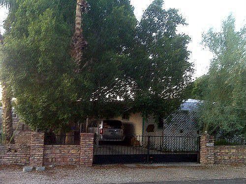 Mature trees, security gates, lots of shade.
