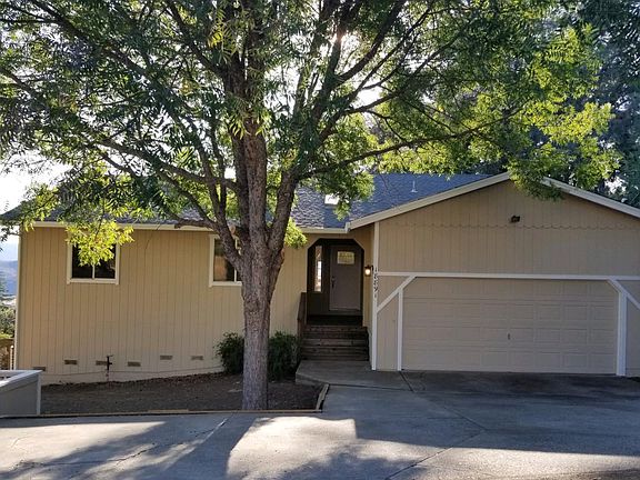 Front view. Fresh paint. Extra parking strip.