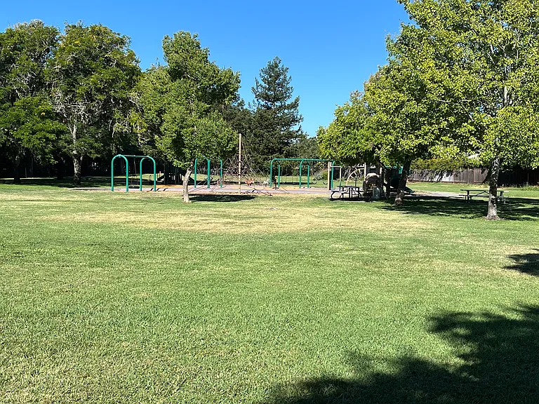 Park behind backyard fence