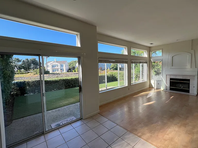 Bright family room with panoramic water view