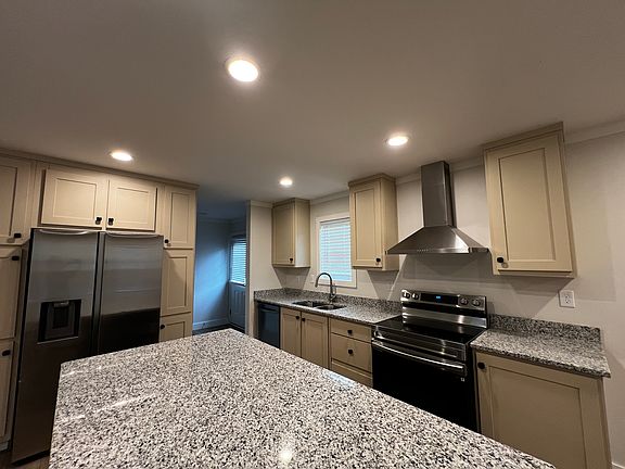 Granite countertops, electric glass-top stove