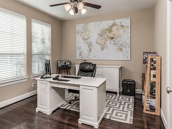 Glass double doors open to the first floor bedroom. Gorgeous hardwood floors, 9' ceilings and large windows that overlook the front yard.